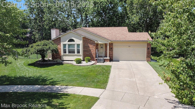 761 Stoney Dr, South Lyon, MI 48178 - single story home with an attached garage, concrete driveway, brick siding, a chimney, and a front yard