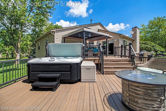761 Stoney Dr, South Lyon, MI 48178 - deck featuring a hot tub and a yard