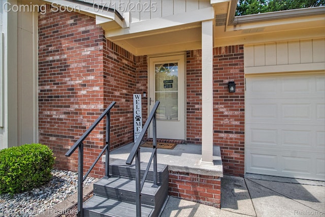 761 Stoney Dr, South Lyon, MI 48178 - property entrance with an attached garage and brick siding