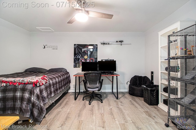 761 Stoney Dr, South Lyon, MI 48178 - bedroom with wood finished floors, a ceiling fan, and an office area