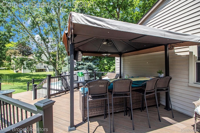 761 Stoney Dr, South Lyon, MI 48178 - wooden terrace featuring a gazebo, a ceiling fan, and a yard