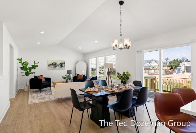3171 Timberpine Ave, Holland, MI 49424 - dining area featuring vaulted ceiling, light wood-style flooring, a chandelier, and recessed lighting