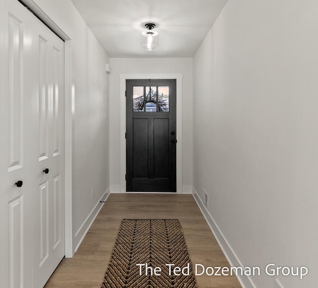 3171 Timberpine Ave, Holland, MI 49424 - doorway with light wood finished floors and baseboards