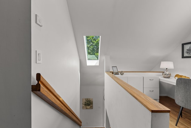 1618 Birmingham Blvd, Birmingham, MI 48009 - staircase featuring wood finished floors, vaulted ceiling, and a skylight