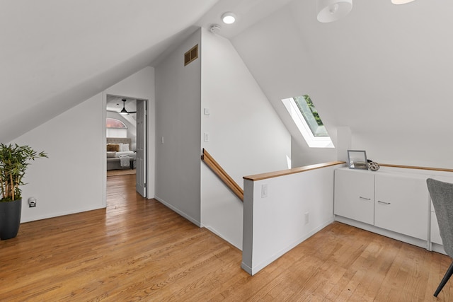 1618 Birmingham Blvd, Birmingham, MI 48009 - additional living space featuring a skylight, vaulted ceiling, and light wood-type flooring