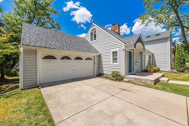 1618 Birmingham Blvd, Birmingham, MI 48009 - view of front of property with driveway, a chimney, roof with shingles, a garage, and a front yard