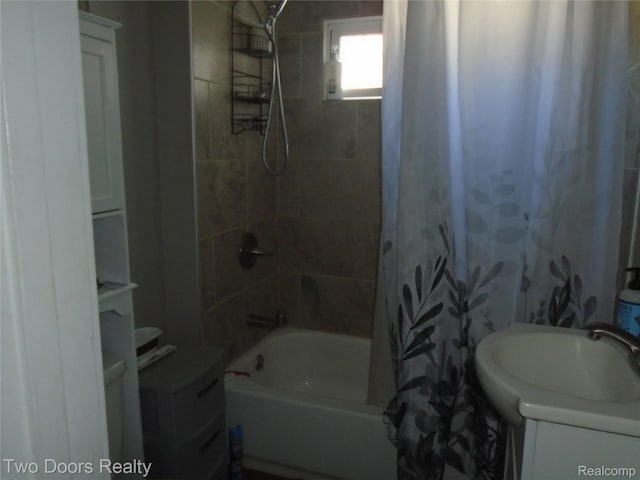 full bathroom featuring shower / bath combo and vanity