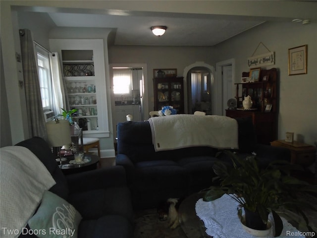 living area with arched walkways