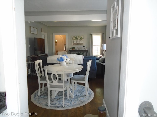 dining space featuring wood finished floors