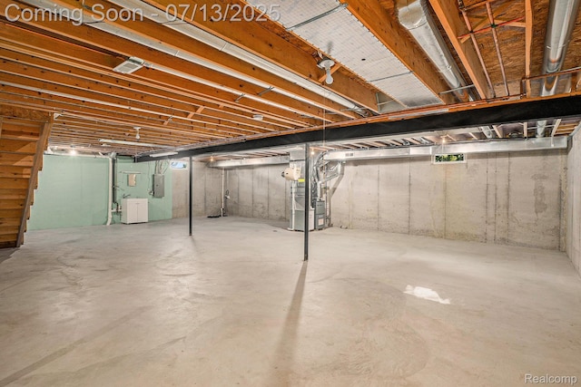 7031 Iris Ct Unit 3, Grand Blanc, MI 48439 - unfinished basement with electric panel and heating unit