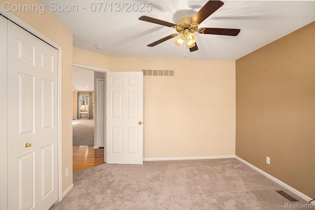 7031 Iris Ct Unit 3, Grand Blanc, MI 48439 - unfurnished bedroom featuring carpet floors and a ceiling fan