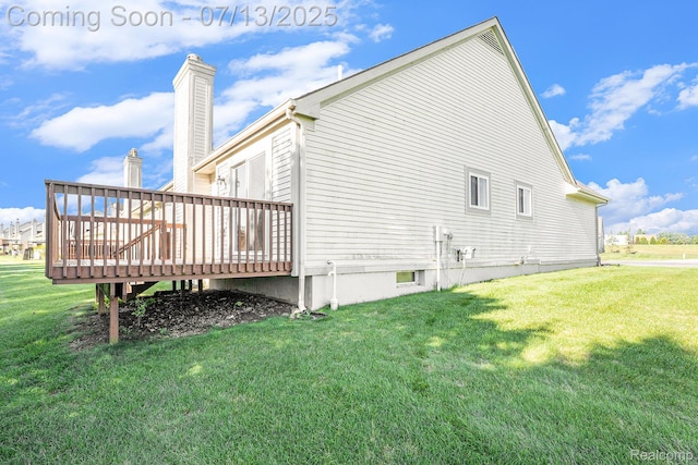 7031 Iris Ct Unit 3, Grand Blanc, MI 48439 - view of home's exterior with a deck, a yard, and a chimney