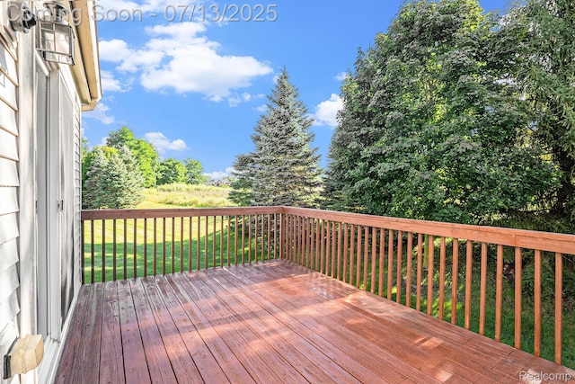 7031 Iris Ct Unit 3, Grand Blanc, MI 48439 - deck featuring a lawn