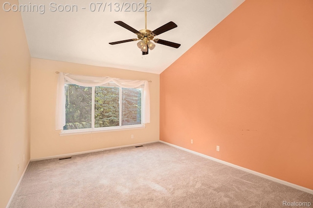 7031 Iris Ct Unit 3, Grand Blanc, MI 48439 - empty room featuring carpet flooring, ceiling fan, and vaulted ceiling