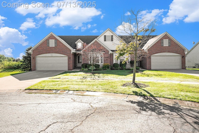 7031 Iris Ct Unit 3, Grand Blanc, MI 48439 - traditional-style home with brick siding, driveway, and a front lawn