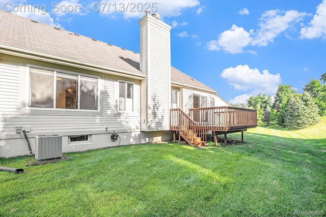 7031 Iris Ct Unit 3, Grand Blanc, MI 48439 - back of property featuring a deck, a chimney, and a lawn