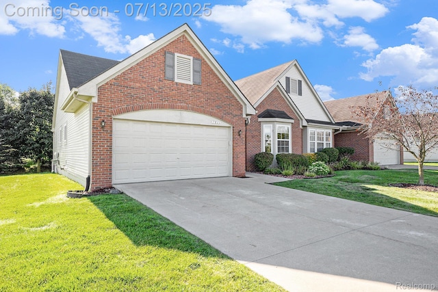 7031 Iris Ct Unit 3, Grand Blanc, MI 48439 - view of front facade featuring a front yard, concrete driveway, a garage, and brick siding
