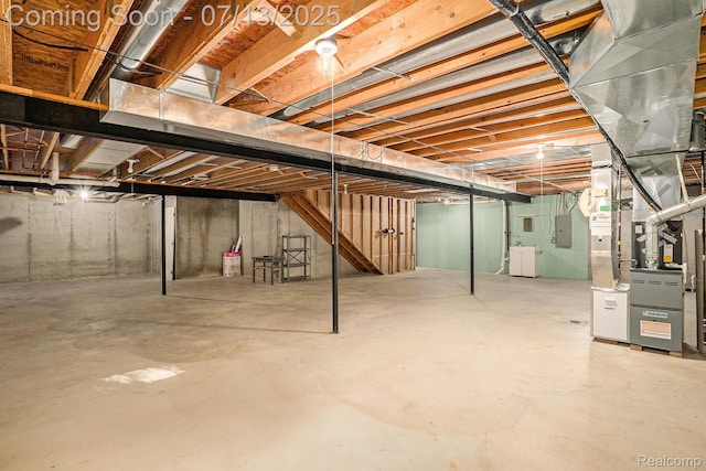 7031 Iris Ct Unit 3, Grand Blanc, MI 48439 - unfinished below grade area with electric panel and heating unit