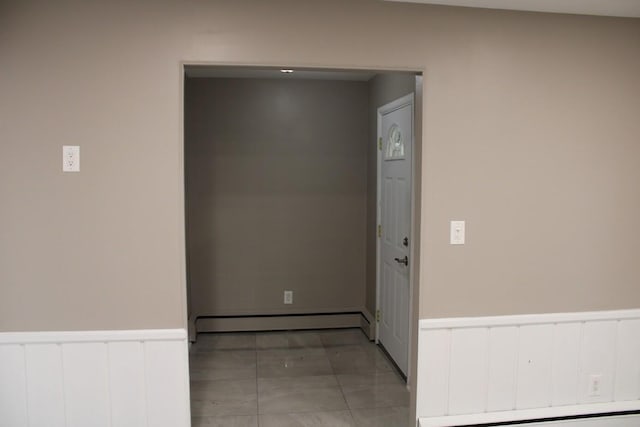 2906 Syracuse St, Dearborn, MI 48124 - hallway with a baseboard radiator, wainscoting, and a baseboard heating unit
