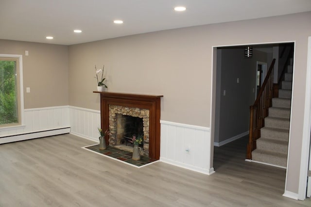 2906 Syracuse St, Dearborn, MI 48124 - unfurnished living room featuring wainscoting, stairs, wood finished floors, recessed lighting, and a stone fireplace