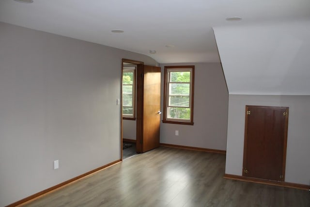 2906 Syracuse St, Dearborn, MI 48124 - bonus room featuring wood finished floors and vaulted ceiling