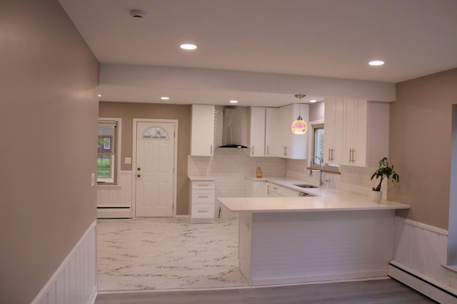 2906 Syracuse St, Dearborn, MI 48124 - kitchen featuring a baseboard heating unit, wall chimney range hood, white cabinetry, and recessed lighting