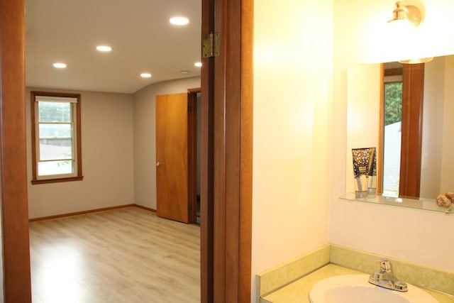 2906 Syracuse St, Dearborn, MI 48124 - bathroom featuring recessed lighting, wood finished floors, and vanity
