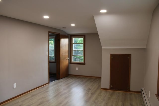 2906 Syracuse St, Dearborn, MI 48124 - bonus room with baseboard heating, light wood-type flooring, vaulted ceiling, and recessed lighting