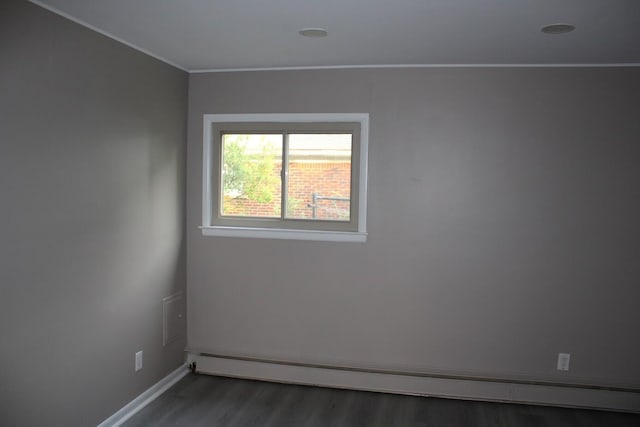 2906 Syracuse St, Dearborn, MI 48124 - empty room with a baseboard heating unit, wood finished floors, and ornamental molding
