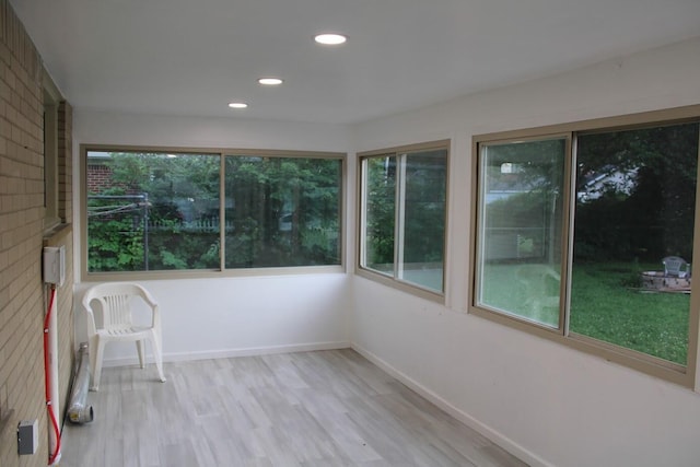 2906 Syracuse St, Dearborn, MI 48124 - unfurnished sunroom featuring plenty of natural light, wood finished floors, and recessed lighting