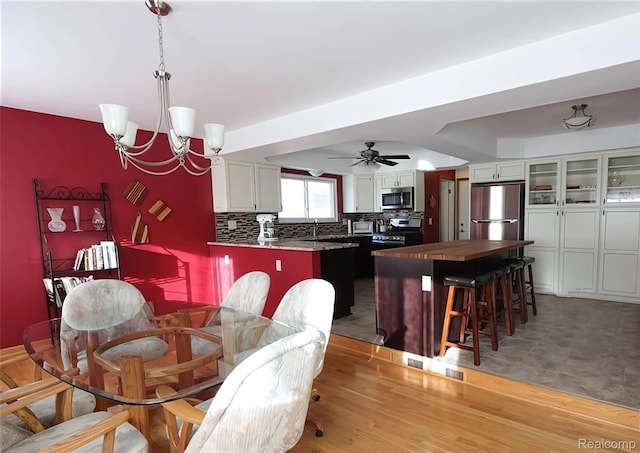 10352 Gulley St, Taylor, MI 48180 - dining space with a chandelier and a ceiling fan