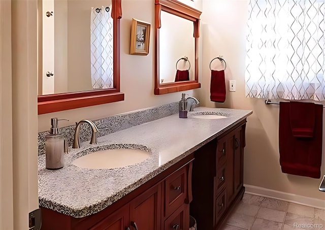 10352 Gulley St, Taylor, MI 48180 - bathroom with double vanity and marble look tile flooring