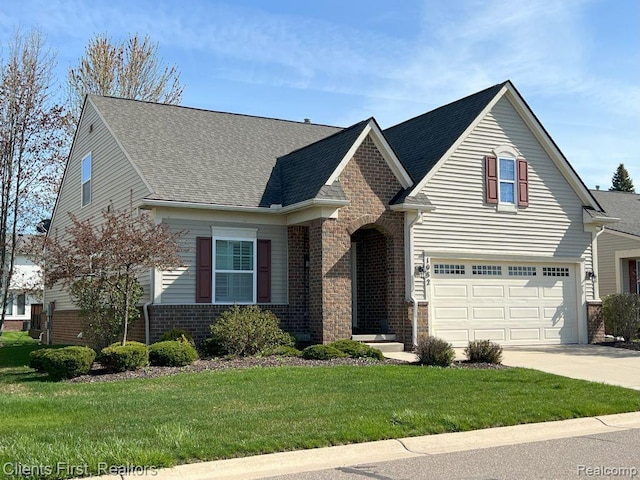 1082 Paddock Dr Unit 78, South Lyon, MI 48178 - traditional home with brick siding, driveway, an attached garage, a front yard, and a shingled roof