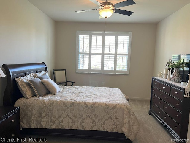 1082 Paddock Dr Unit 78, South Lyon, MI 48178 - bedroom with light colored carpet and ceiling fan