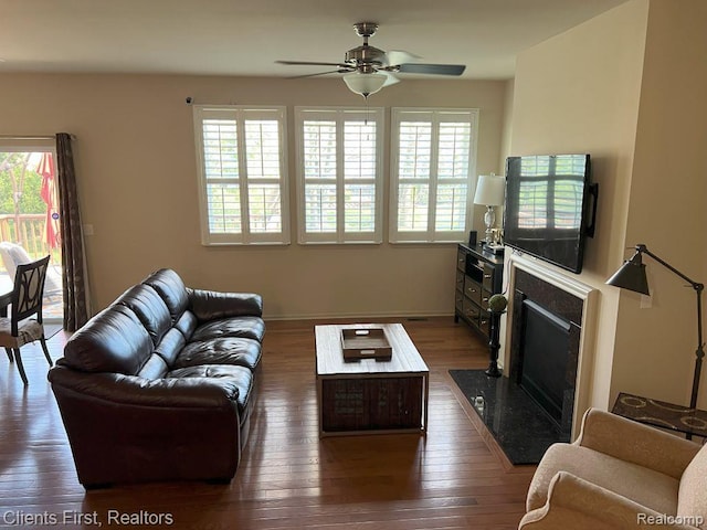1082 Paddock Dr Unit 78, South Lyon, MI 48178 - living area featuring ceiling fan, plenty of natural light, and dark wood-type flooring