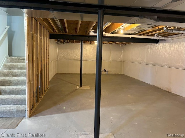 1082 Paddock Dr Unit 78, South Lyon, MI 48178 - unfinished basement with stairs