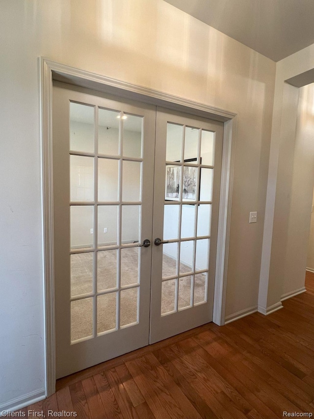 1082 Paddock Dr Unit 78, South Lyon, MI 48178 - doorway to outside featuring french doors and wood finished floors