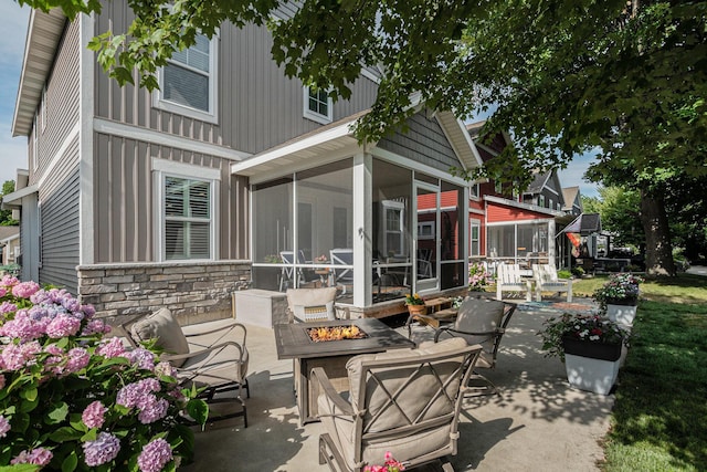 330 Rachaels Way, Spring Lake, MI 49456 - view of patio / terrace featuring a fire pit and a sunroom
