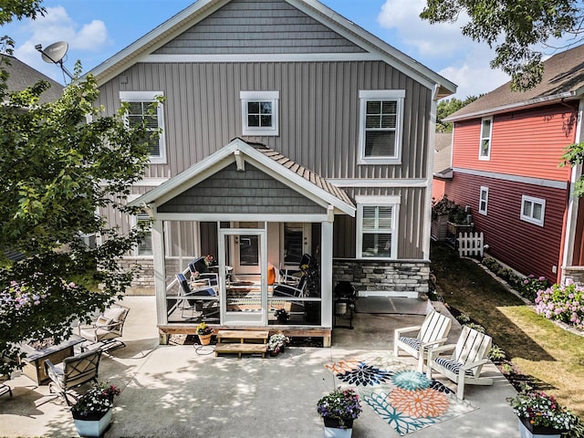 330 Rachaels Way, Spring Lake, MI 49456 - rear view of house with a patio and stone siding