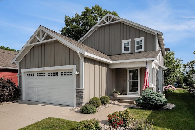 330 Rachaels Way, Spring Lake, MI 49456 - view of front facade featuring roof with shingles, a garage, concrete driveway, a front lawn, and board and batten siding