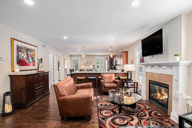 330 Rachaels Way, Spring Lake, MI 49456 - living room featuring dark wood-type flooring, recessed lighting, and a fireplace