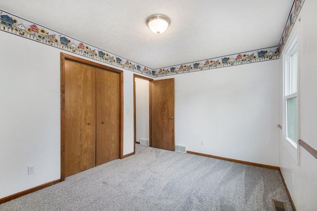 8728 Cottonwood Dr, Jenison, MI 49428 - unfurnished bedroom with carpet flooring and a closet