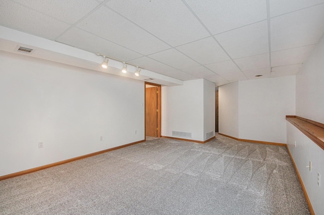8728 Cottonwood Dr, Jenison, MI 49428 - finished basement featuring light colored carpet, track lighting, and a paneled ceiling
