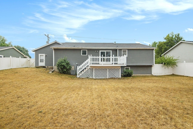 8728 Cottonwood Dr, Jenison, MI 49428 - back of house with a wooden deck, a fenced backyard, and roof with shingles