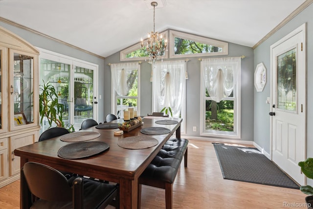 3439 N Mill Rd, Dryden, MI 48428 - dining space with vaulted ceiling, plenty of natural light, a chandelier, light wood finished floors, and crown molding