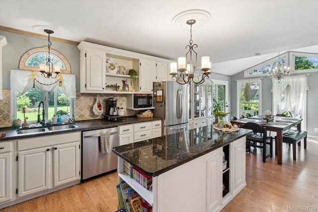 3439 N Mill Rd, Dryden, MI 48428 - kitchen featuring open shelves, a chandelier, stainless steel appliances, and lofted ceiling