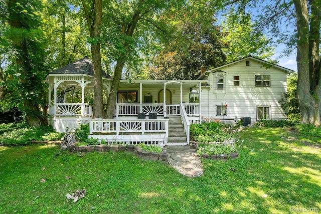 3439 N Mill Rd, Dryden, MI 48428 - rear view of property with a porch and a lawn