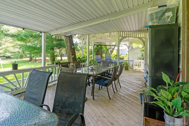 3439 N Mill Rd, Dryden, MI 48428 - deck featuring outdoor dining area and a storage shed