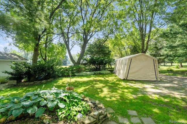 3439 N Mill Rd, Dryden, MI 48428 - view of green lawn with a shed