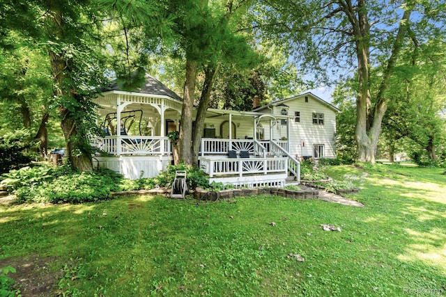 3439 N Mill Rd, Dryden, MI 48428 - view of front facade with a porch and a front lawn